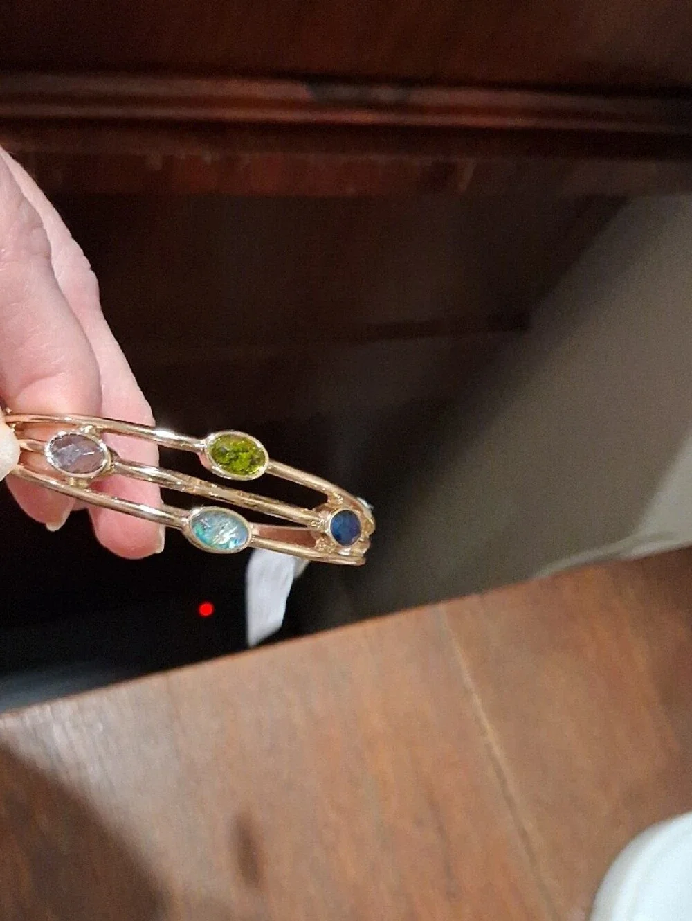 Anne Klein Gold-Tone Bangle with Green, Blue and Clear Stones